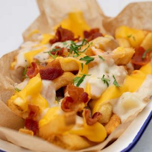 Chowder drenched french fries, topped with bacon and cheddar.